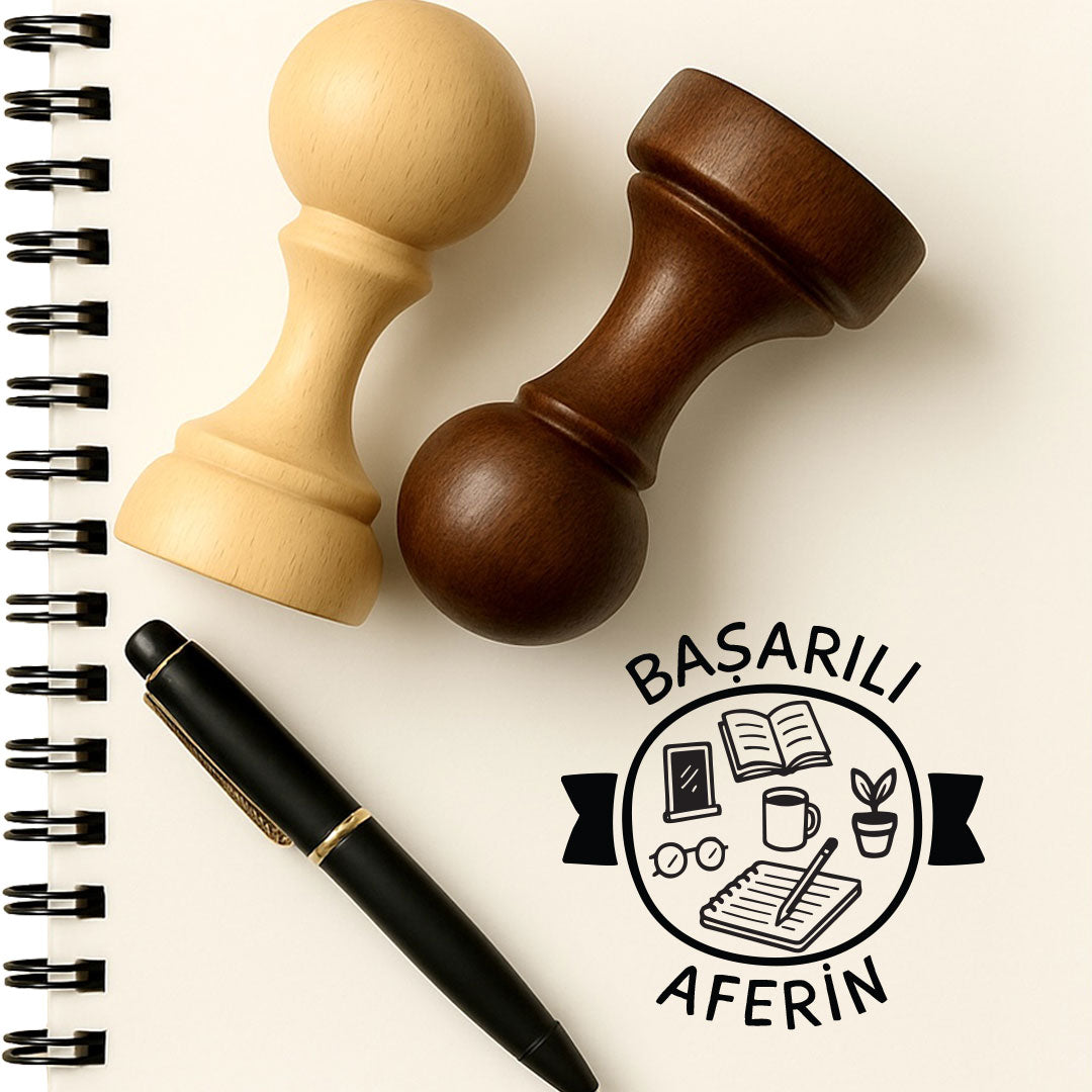 Başarılı Aferin mührü, ahşap saplı mühür ve not defteri üzerine basılmış yazı örneği